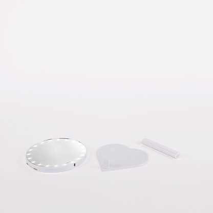 The RIKI GRACEFUL handheld magnifying face mirror in black with 7X magnification and LED lights.